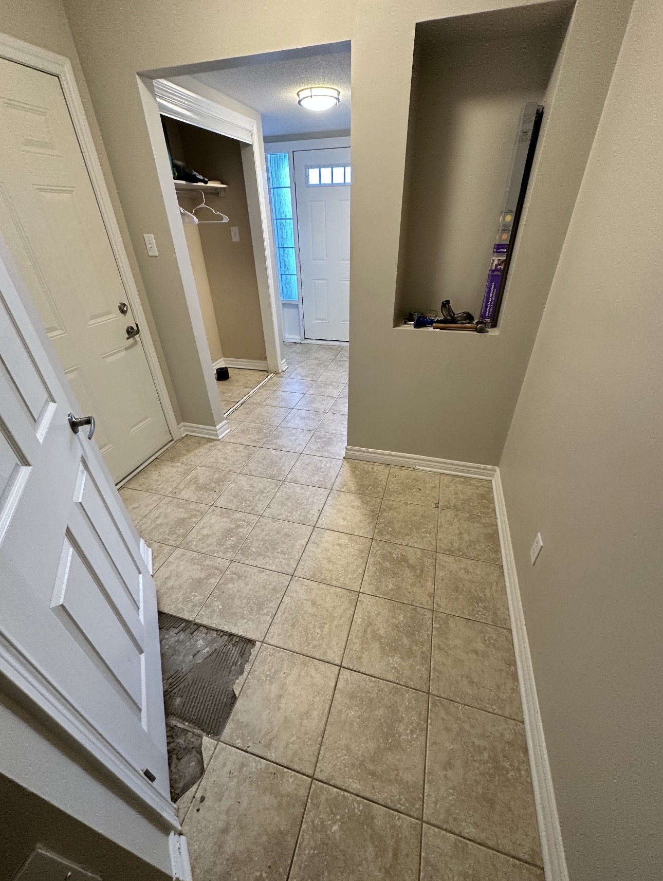 Kanata home entryway before painting — beige walls