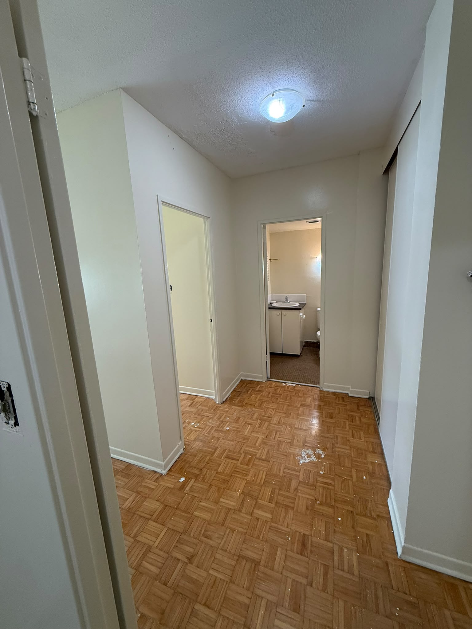Apartment hallway after painting — fresh white walls