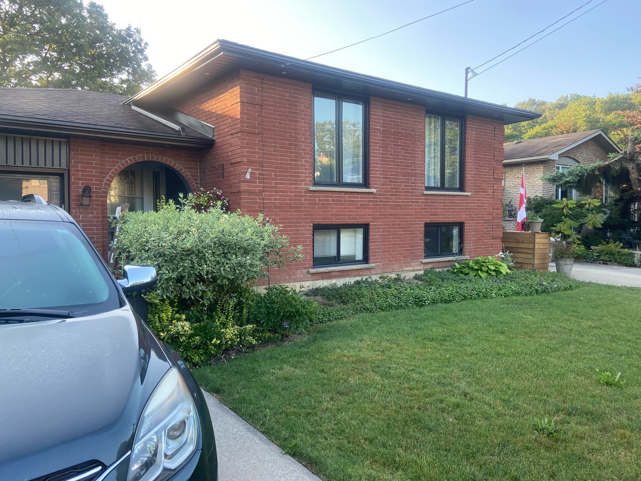 Barrhaven home exterior before painting — original red brick facade