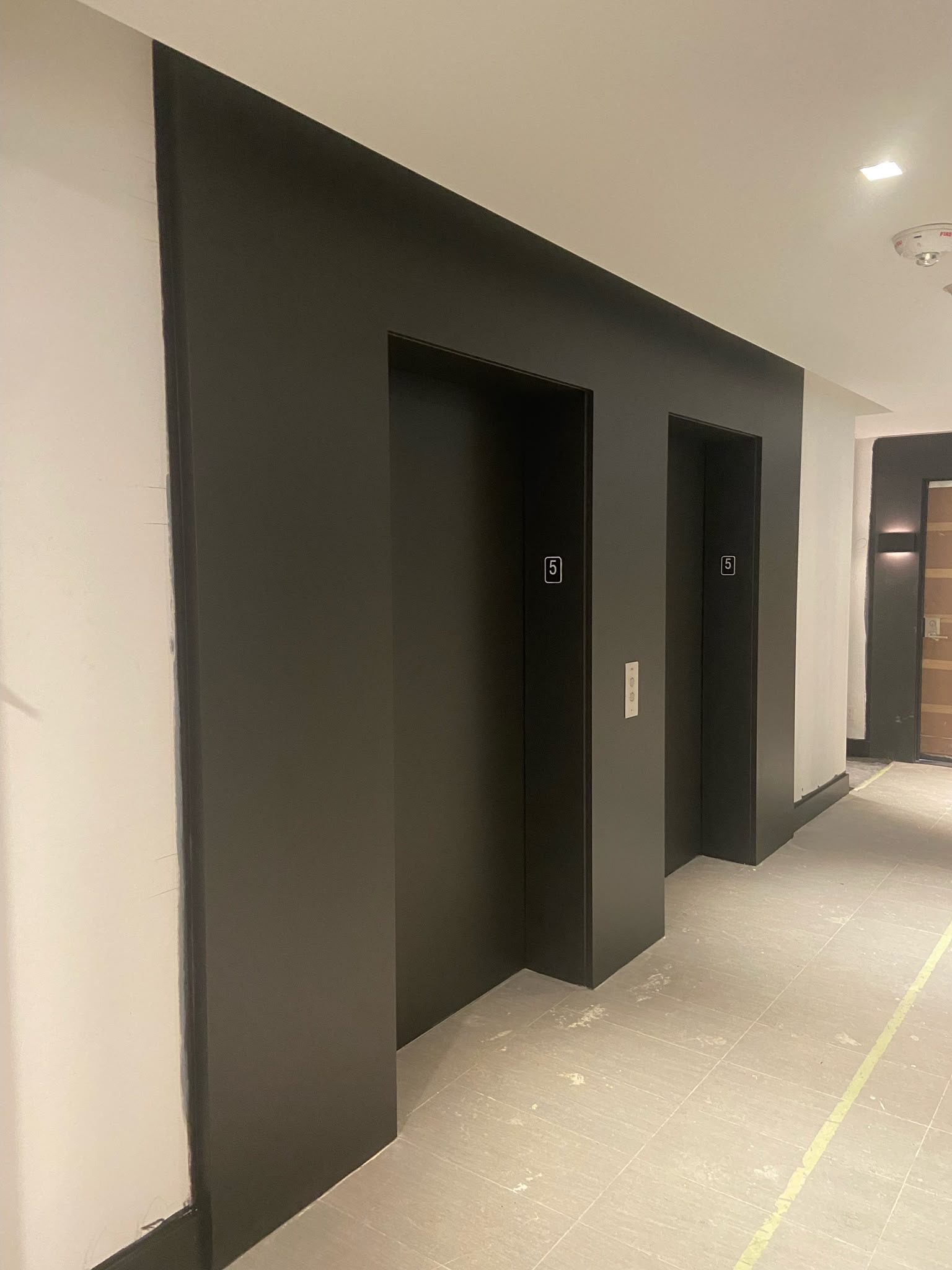 Ottawa condo elevator lobby after painting — polished corridor with fresh professional paint finish